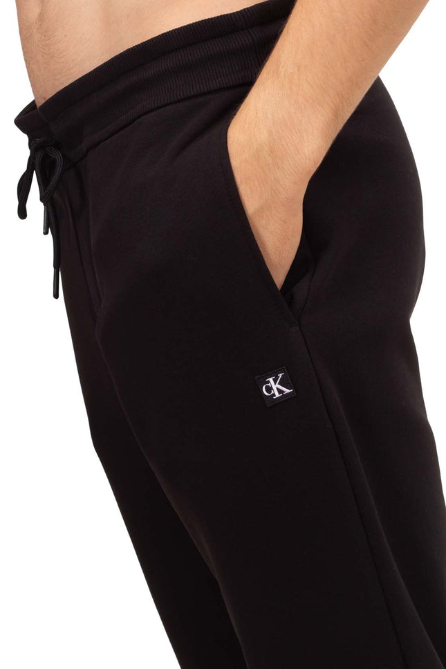 CALVIN KLEIN JEANS - Pantaloni sportivi uomo con patch logo-0